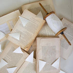 White Paper Flag Garland On Wood Spool