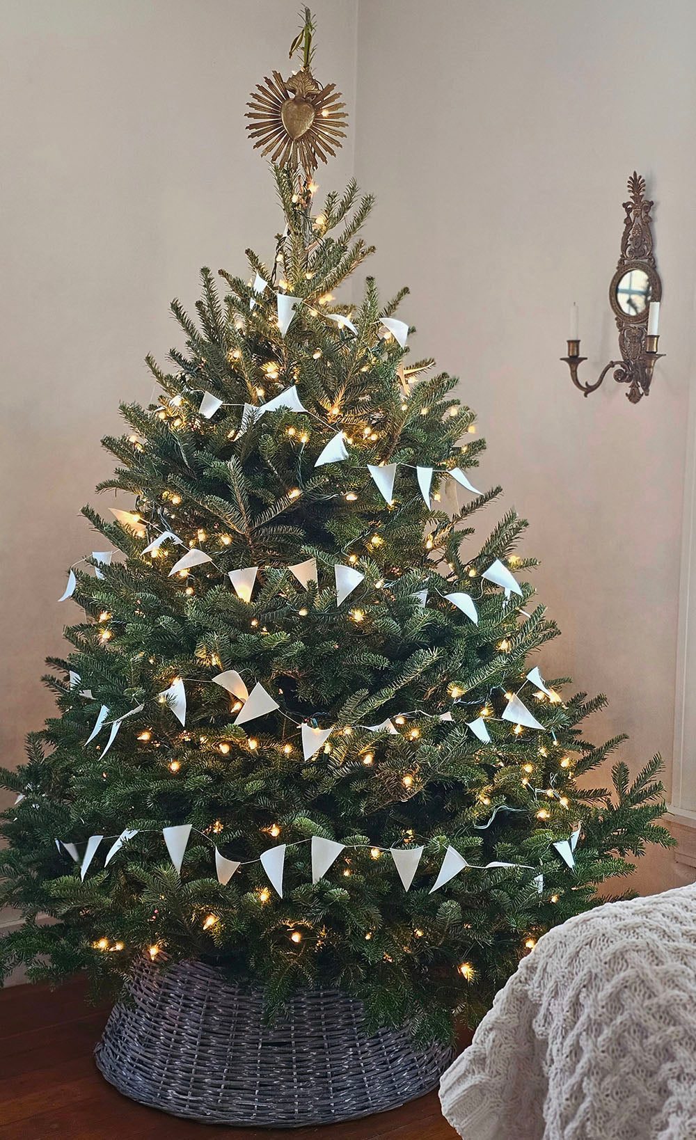 White Paper Flag Garland On Wood Spool