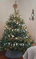 White Paper Flag Garland On Wood Spool